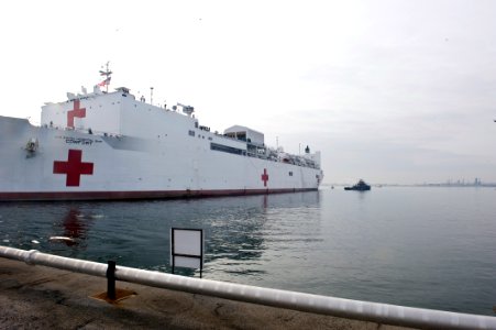 US Navy 100116-N-XXXXX-257 The Military Sealift Command (MSC) hospital ship USNS Comfort (T-AH 20) pulls away from Canton Pier for a short notice humanitarian deployment to Port-au-Prince, Haiti