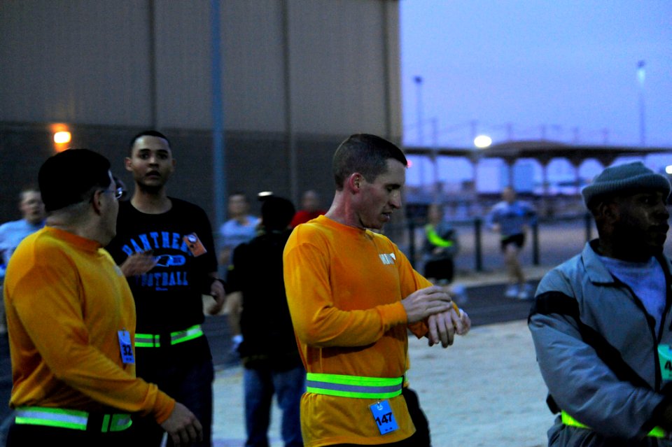 US Navy 100118-N-9500T-012 Runners check their time against the official clock after completing a 5-killometer run to commemorate the birthday of the Rev. Dr. Martin Luther King Jr