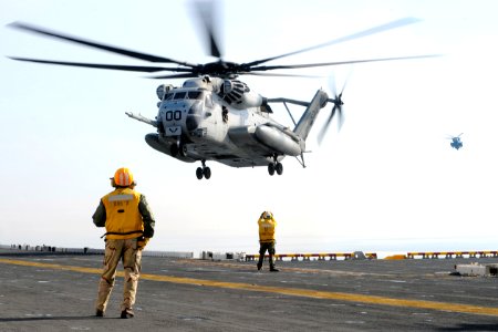 US Navy 100116-N-5345W-028 A CH-53E Super Stallion from the Ironhorse of Marine Heavy Helicopter Squadron (HMH) 461 prepares to touch down on the multi-purpose amphibious assault ship USS Bataan (LHD 5) photo