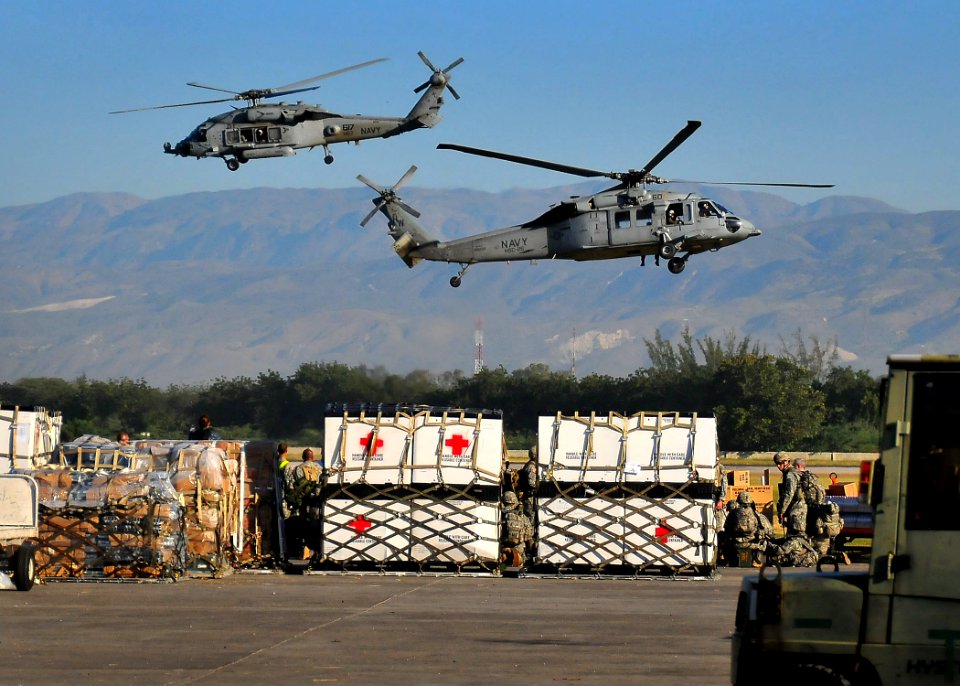US Navy 100118-N-4774B-006 U.S. Navy SH-60F Sea Hawk helicopters from the Nimitz-class aircraft carrier USS Carl Vinson (CVN 70) transport water and supplies from the airport to areas around Port-au-Prince