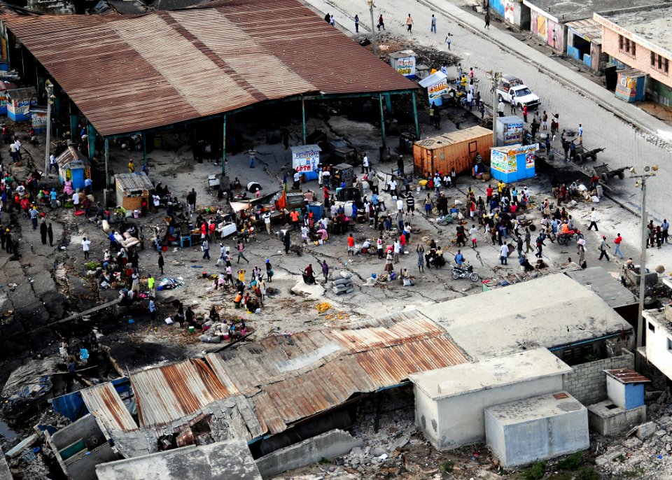 US Navy 100116-N-6247V-137 Haitian citizens gather in a dilapidated marketplace in Port-au-Prince, Haiti, Jan. 16