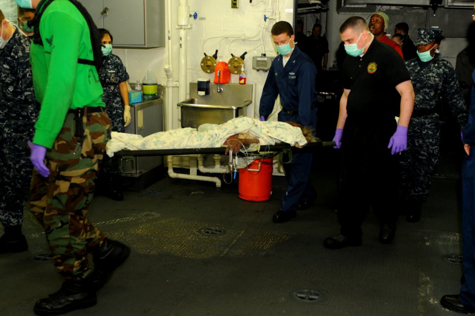 US Navy 100119-N-1831S-076 A 70-year-old Haitian woman arrives aboard the multi-purpose amphibious assault ship USS Bataan (LHD 5) following a medical evacuation