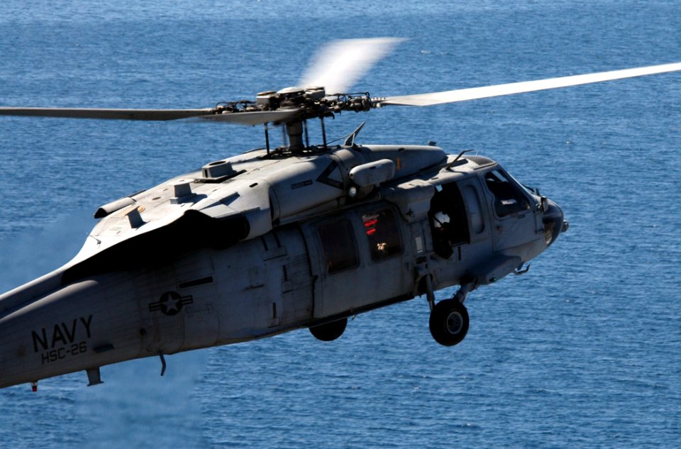 US Navy 100118-N-8822R-060 An SH-60C Sea Hawk helicopter assigned to Helicopter Sea Combat Squadron (HSC) 26 prepares to land aboard the Nimitz-class aircraft carrier USS Carl Vinson (CVN 70)
