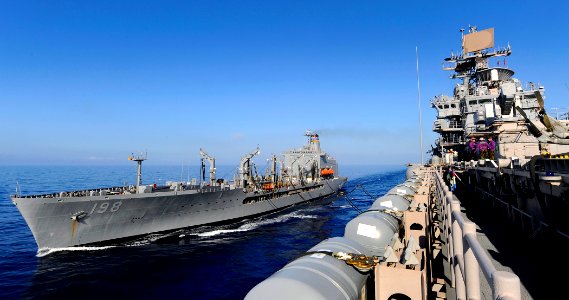 US Navy 100118-N-5345W-019 The multi-purpose amphibious assault ship USS Bataan (LHD 5) takes on fuel and supplies from the Military Sealift Command fleet replenishment oiler USNS Big Horn (T-AO 198)