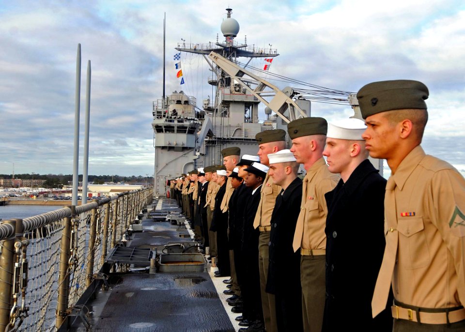 US Navy 100118-N-1082Z-003 Sailors and Marines man the rails aboard the amphibious dock landing ship USS Ashland (LSD 48)