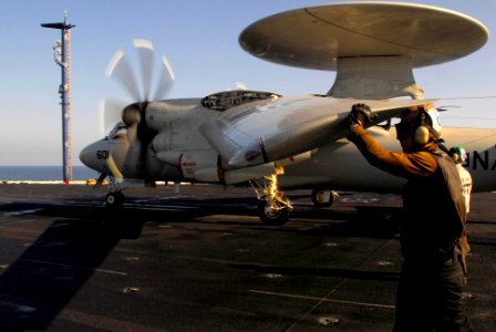 US Navy 100118-N-3327M-003 Aviation Electronics Technician Airman Ryan Coffey, assigned to the Wallbangers of Carrier Airborne Early Warning (VAW) 117, performs final checks on an E2-C Hawkeye