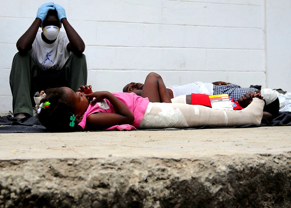 US Navy 100119-N-6247V-883 A Haitian girl awaits medical evacuation at the Killick Haitian Coast Guard Clinic in Carrefour, Haiti