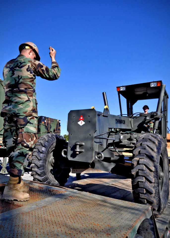 US Navy 100119-N-6889J-038 Seabees assigned to Naval Mobile Construction Battalion (NMCB) 7 prepare civil engineer support equipment for shipment to Haiti