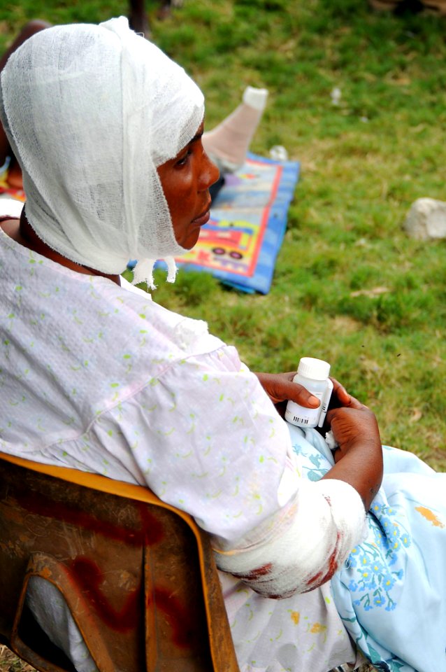 US Navy 100119-N-6247V-737 A Haitian women rests after she received medical treatment and medication at the Killick Haitian Coast Guard Clinic in Carrefour, Haiti