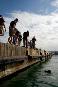 US Navy 100119-N-1134L-001 Members of the media document the Army's 544th Engineer Dive Team as they conduct pier inspections in Port-au-Prince after a 7.0 magnitude earthquake damaged large sections of the port Jan. 12