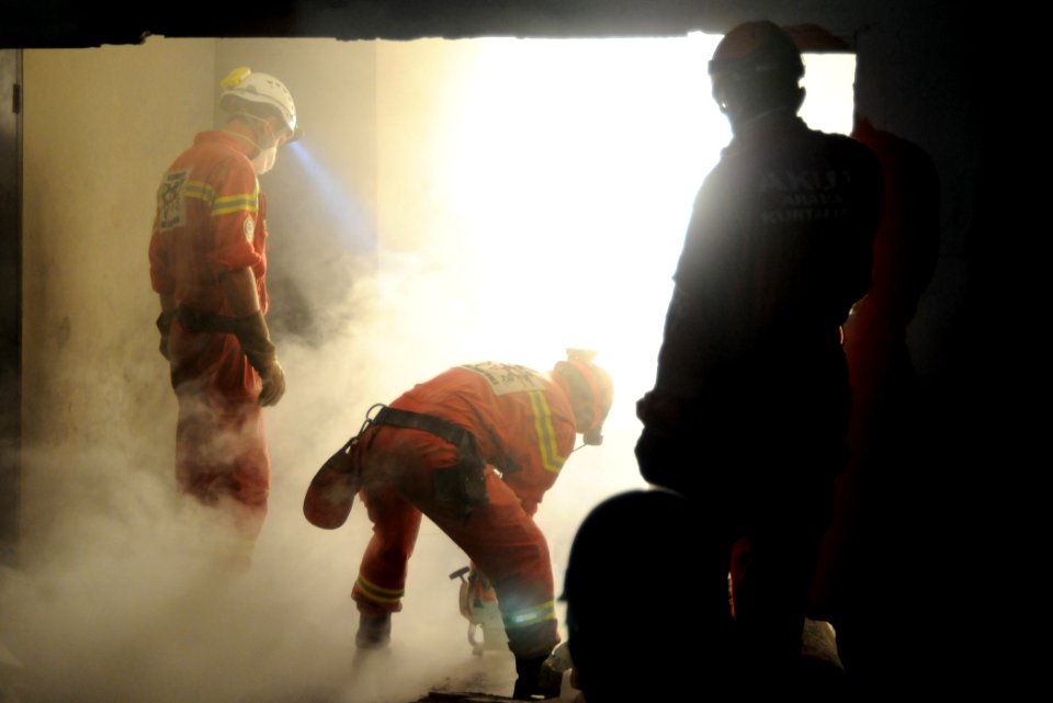 US Navy 100119-N-8878B-683 Search and Rescue teams rescue Hottline Lozoma, a 25-year-old Haitian woman, who was trapped in rubble for eight days