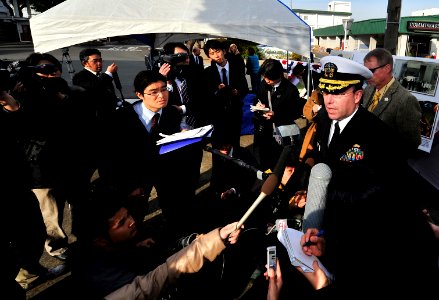 US Navy 100119-N-0807W-158 Capt. Francis X. Martin, commander of Fleet Activities Sasebo, speaks with Japanese media at a ceremony celebrating the 50th anniversary of the signing of the Treaty of Mutual Cooperation and Security photo