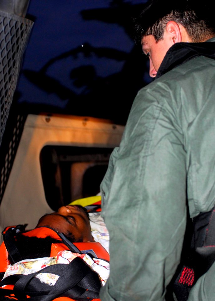 US Navy 100119-N-5244H-036 A Haitian woman with life-threatening injuries is medically evacuated to USS Bataan (LHD 5)