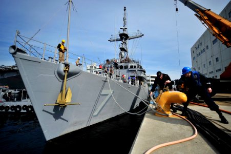 US Navy 100119-N-0807W-020 Line-handlers assist the forward-deployed mine countermeasures ship USS Patriot (MCM 7) as she leaves her berth at Fleet Activities Sasebo t