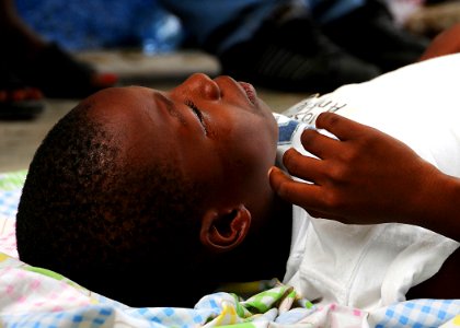 US Navy 100119-N-6247V-690 A Haitian boy arrives at Killick Haitian Coast Guard Clinic in Carrefour, Haiti for treatment. Personnel from the aircraft carrier USS Carl