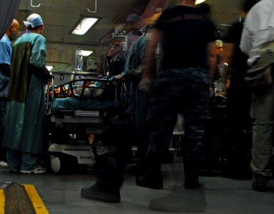 US Navy 100119-N-4047W-008 Medical personnel conduct a casualty receiving drill aboard the Military Sealift Command hospital ship USNS Comfort (T-AH 20) photo