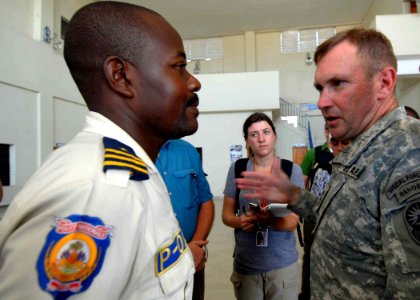US Navy 100120-N-6639M-002 Lt. Gen. P.K. Keen, commander of Joint Task Force Haiti, visits Azistude Rosemond, chief of police in Cite De Soleil, Haiti