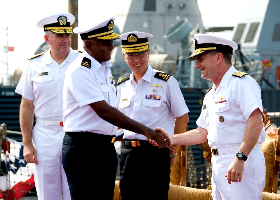 US Navy 100120-N-8825R-194 Vice Adm. Bill Gortney, right, commander of Combined Maritime Forces, congratulates Singapore Navy Rear Adm. Bernard Miranda after he assumed command of Combined Task Force (CTF) 151