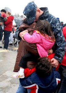 US Navy 100121-N-5087R-035 Fire Controlman 2nd Class Josh Holliday embraces his family