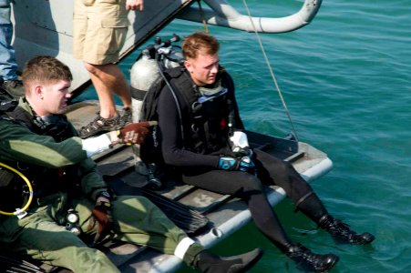 US Navy 100120-N-1134L-144 Staff Sgt. Stephen Key and Sgt. Randy Mackey prepare to conduct underwater pier inspections in Port-au-Prince