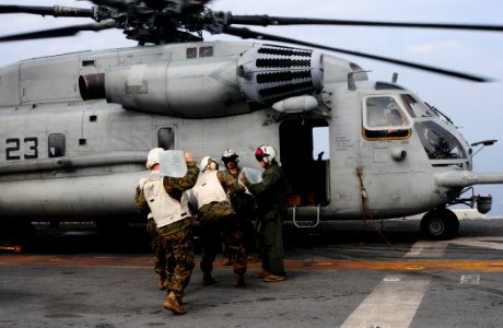 US Navy 100119-N-7508R-044 Marines load water onto a CH-53E Super Stallion helicopter aboard USS Bataan (LHD 5)
