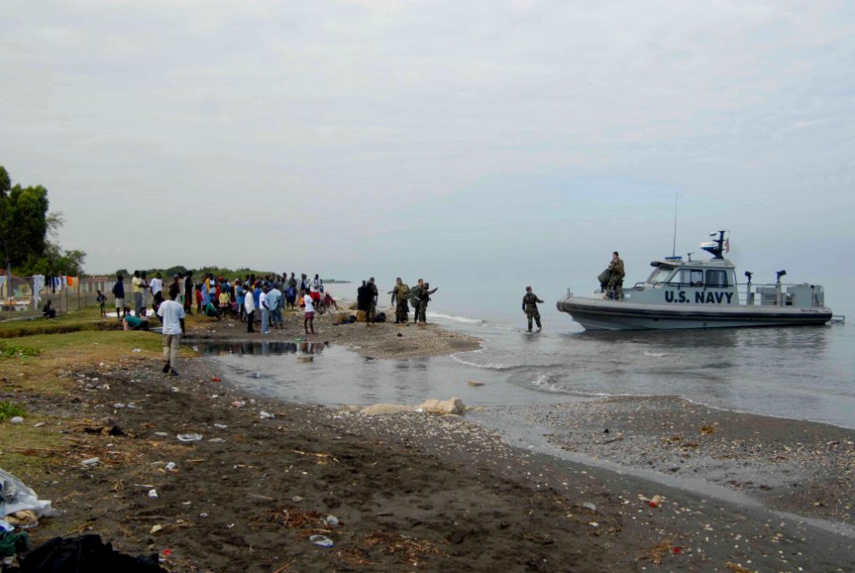 US Navy 100119-N-7653W-076 Sailors guide an assault craft unit onto the shore of Port-Au-Prince, Haiti