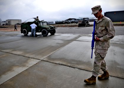 US Navy 100121-N-6889J-005 Seabees assigned to Naval Mobile Construction Battalion (NMCB) 133 conduct five-meter and twenty-five-meter checks around their vehicles at Naval Construction Battalion Center Gulfport, Miss