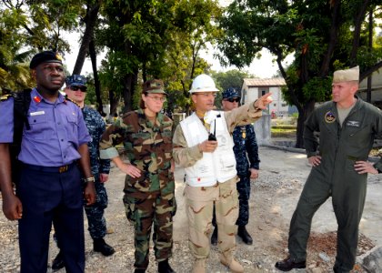 US Navy 100119-N-6676S-004 Commanders are briefed on the helicopter landing situation at the Killick Haitian Coast Guard Base photo