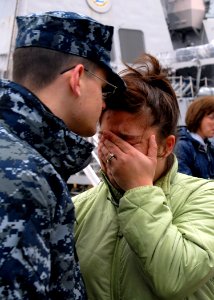 US Navy 100121-N-5087R-040 unner's Mate Seaman Daniel Talbot conmforts his wife before he departs for a seven-month deployment aboard the guided missile cruiser USS San Jacinto (CG 56)