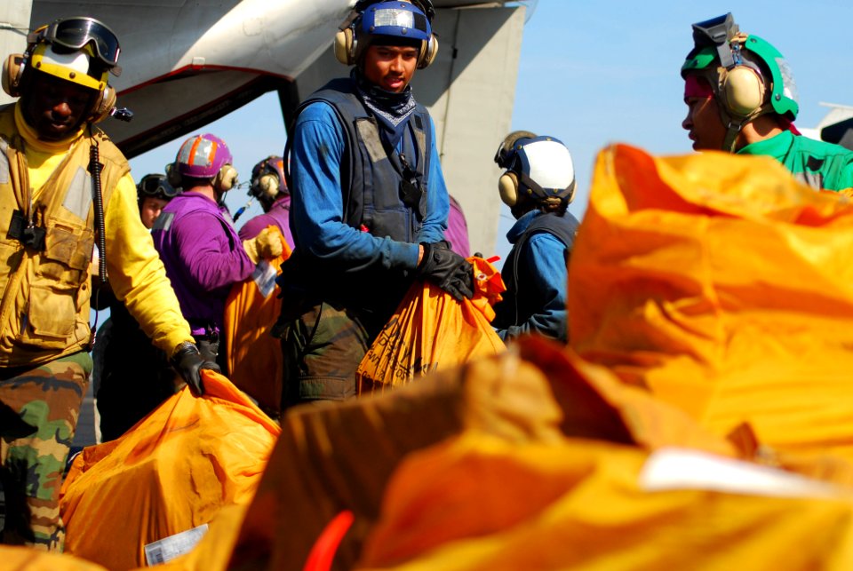 US Navy 100120-N-3589B-062 ailors sort incoming mail aboard the aircraft carrier USS Nimitz (CVN 68). The Nimitz Carrier Strike Group is on a routine deployment to the U.S. 5th Fleet area of responsibility