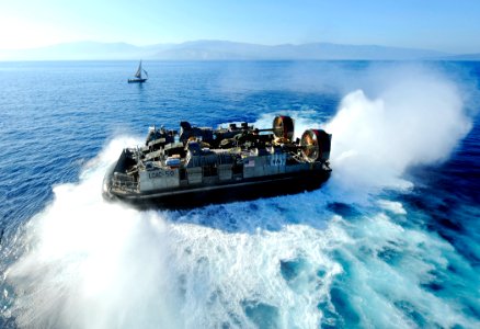 US Navy 100122-N-5345W-006 A landing craft air cushion exits the well deck of USS Bataan (LHD 5)