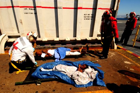 US Navy 100121-N-2953W-035 Sailors from USS Carl Vinson (CVN 70) medically evacuate Haitian children from Port-au-Prince, Haiti