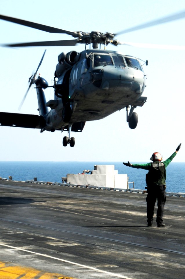 US Navy 100123-N-3038W-312 SH-60F Sea Hawk helicopter lands aboard USS Nimitz