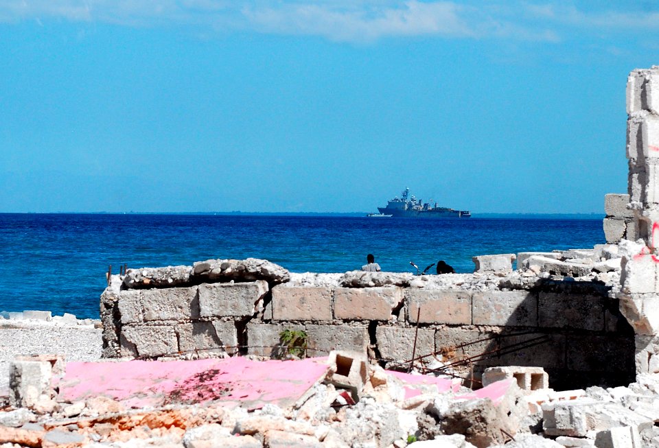 US Navy 100121-N-5244H-125 The amphibious dock landing ship USS Carter Hall (LSD 50) is seen off the coast of Grand Grove, Haiti