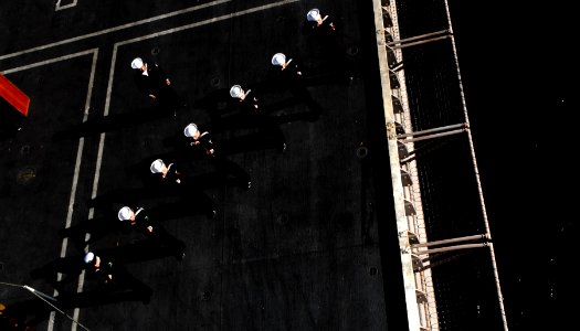 US Navy 100123-N-2475A-214 The honor guard fires a rifle volley during a burial at sea ceremony aboard the Nimitz-class aircraft carrier USS John C. Stennis (CVN 74)