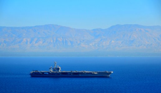 US Navy 100123-N-4774B-009 The Nimitz-class aircraft carrier USS Carl Vinson (CVN 70) maneuvers off the coast of Haiti while launching aircraft delivering humanitarian supplies