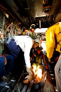 US Navy 100121-N-2953W-724 Sailors medically evacuate Haitian citizens from La Gonave Island