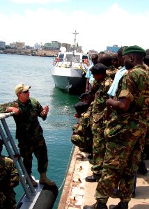 US Navy 100121-N-XXXXH-098 Constructionman 1st Class Robert Taylor, an Africa Partnership Station (APS) East instructor, teaches a small boat maintenance course to Tanzanian maritime students in Dar Es Salaam, Tanzania