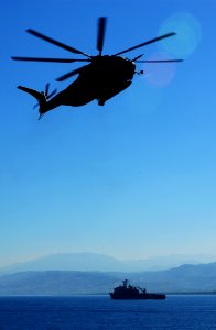 US Navy 100121-N-7508R-042 A CH-53E Super Stallion helicopter approaches USS Bataan (LHD 5) as USS Fort McHenry (LSD 43) operates off the coast of Port-au-Prince