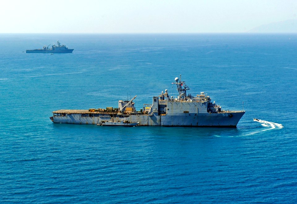 US Navy 100122-N-5345W-104 The amphibious dock landing ships USS Carter Hall (LSD 50) and USS Fort McHenry (LSD 43) operate off the coast of Haiti while participating in Operation Unified Response