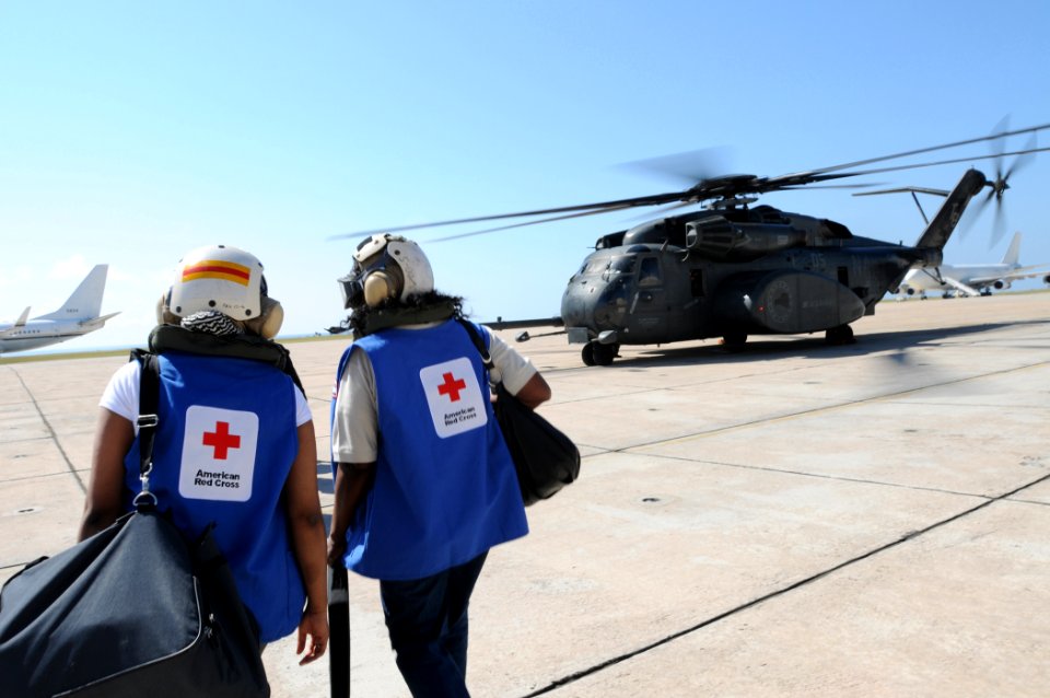 US Navy 100122-N-7456N-077 American Red Cross volunteers board an MH-53E Sea Dragon helicopter bound for Haiti at Naval Station Guantanamo Bay airfield