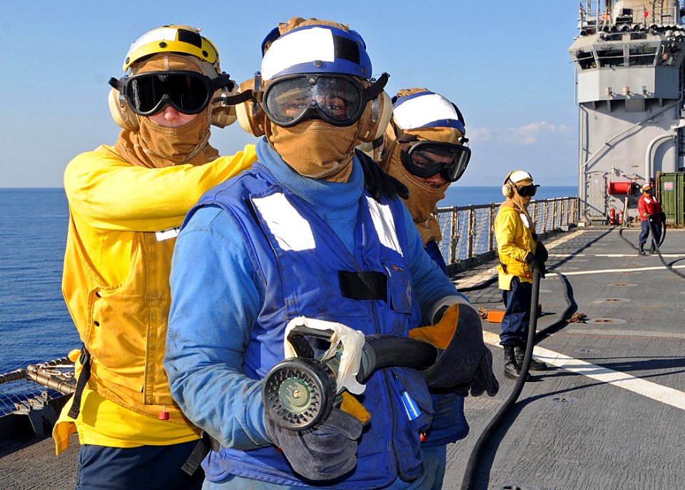 US Navy 100123-N-1082Z-051 Sailors aboard the amphibious dock landing ship USS Ashland (LSD 48) participate in a flight deck firefighting drill