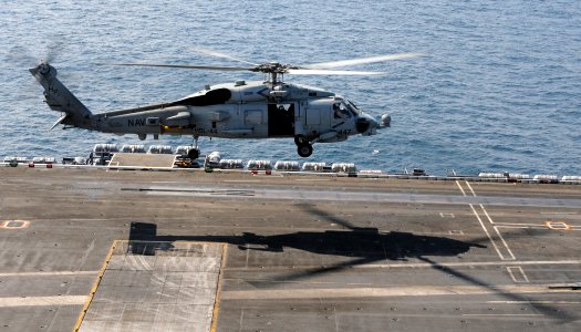 US Navy 100125-N-4236E-061 An SH-60B Sea Hawk helicopter assigned to the Swamp Foxes of Helicopter Anti-Submarine Squadron Light (HSL) 44 lands on the flight deck