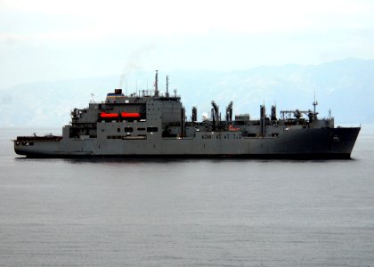 US Navy 100125-N-4971L-117 he Military Sealift Command dry cargo ammunition ship USNS Sacagawea (T-AKE 2) delivers stores and relief supplies to the amphibious dock landing ship USS Fort McHenry (LSD 43) off the coast of Haiti