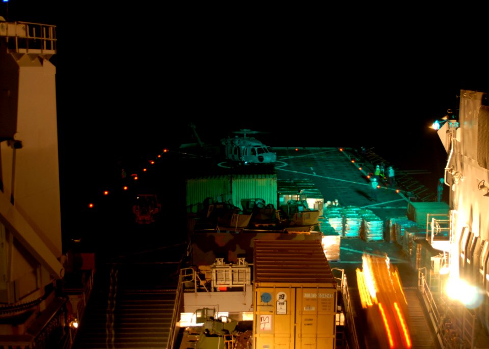 US Navy 100125-N-2000D-074 An MH-60S Sea Hawk helicopter assigned to Helicopter Sea Combat Squadron (HSC) 2, prepares to lift off from the flight deck aboard amphibious dock landing ship USS Carter Hall (LSD 50)