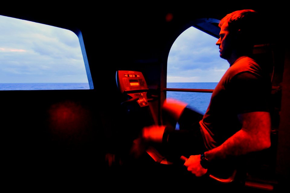 US Navy 100123-N-6003P-019 Lt. Sean McGlade, from Carrollton, Texas, takes time out of his work schedule to exercise on board the Nimitz-class aircraft carrier USS Harry S. Truman (CVN 75)