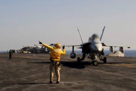 US Navy 100123-N-3327M-192 USS Nimitz sailor directs aircraft on the flight deck