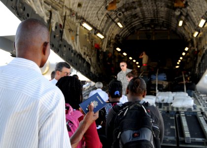 US Navy 100123-N-6247V-135 Haitian-Americans prepare to board a U.S. Air Force C-17 Globemaster III transport aircraft destined for the United States