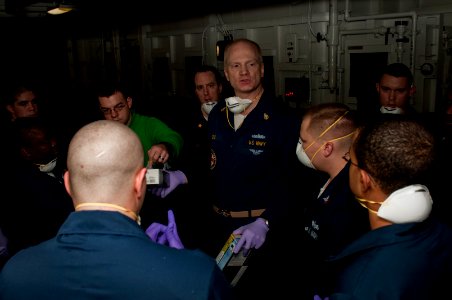US Navy 100123-N-5712P-008 Senior Chief Hospital Corpsman Scott Radke briefs hospital corpsman and medical volunteers photo