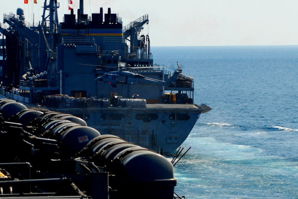 US Navy 100124-N-3589B-075 An MH-60S Sea Hawk helicopter assigned to the Wild Cards of Helicopter Sea Combat Squadron (HSC) 23, delivers supplies to the aircraft carrier USS Nimitz (CVN 68)
